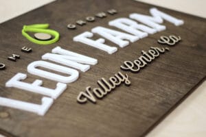 Custom farm home-grown wood laser cut aged walnut stain sign with white logo