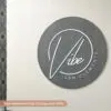 custom hairdresser sign with weathered grey base and white laser cut business logo