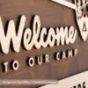 custom national park service welcome sign with aged walnut base and custom personalized natural laser cut wood family surname