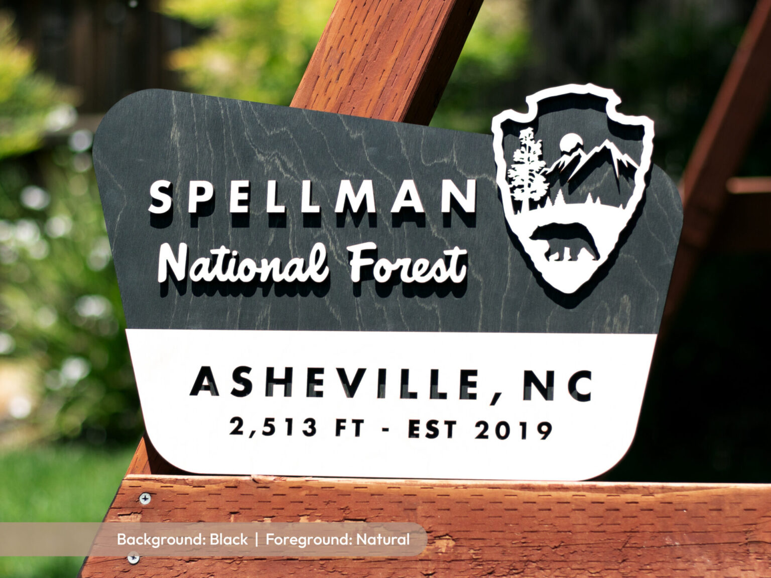 custom national forest sign with black ebony stain and family surname on laser cut birch wood personalized with family hometown and last name