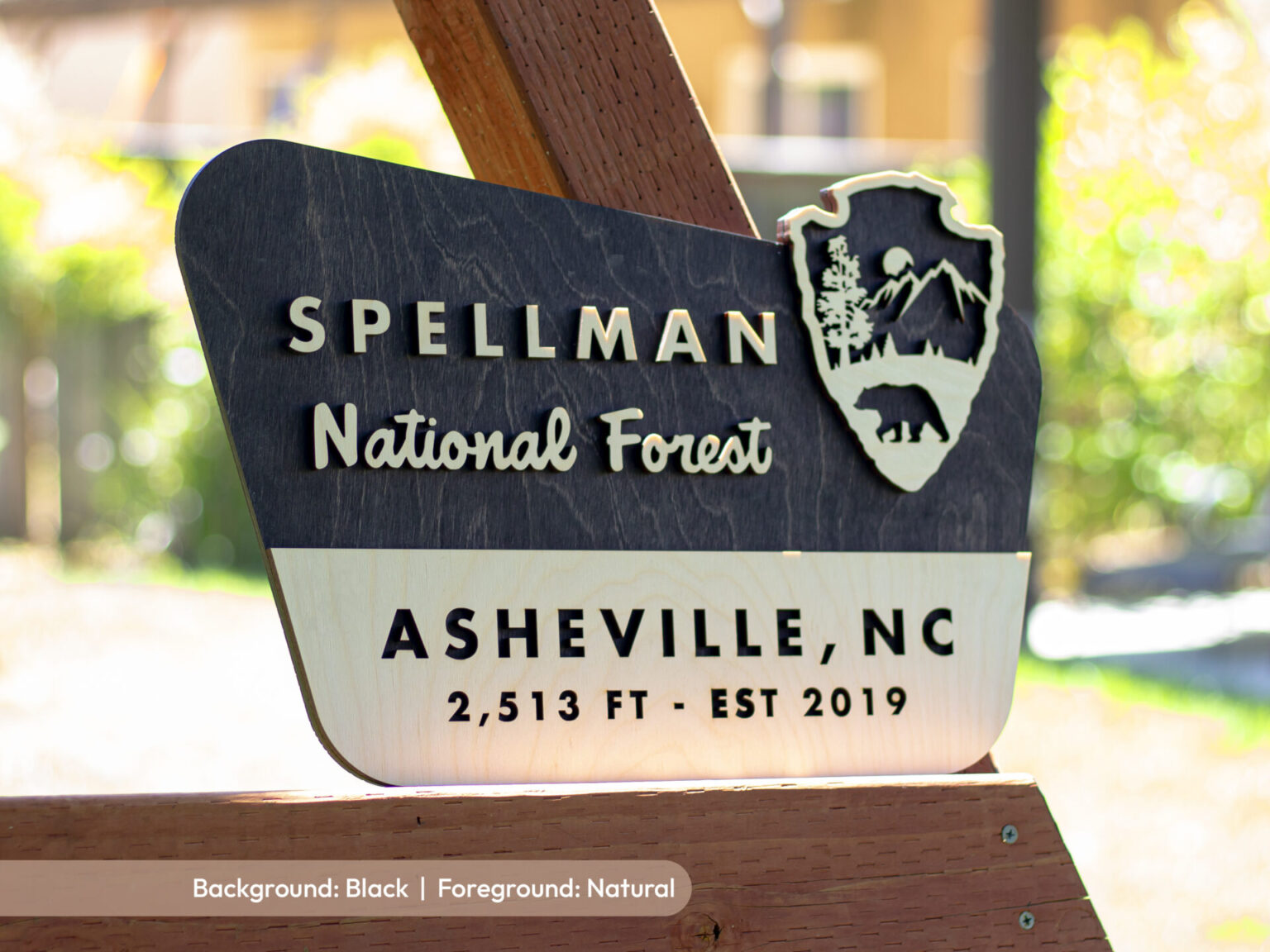 custom national forest welcome sign with black stain and a bear logo