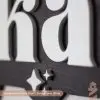 close up of laser cut custom first name wooden boy's bedroom sign for bedroom, nursery or playroom.