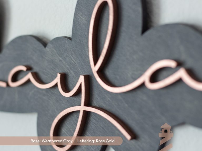 Elegant girl's laser cut wood bedroom nursery sign with grey base and rose gold lettering. Custom first name sign.