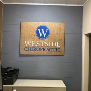 Western oak wood sign with 3D lettering for an chiropractic office space customized sign