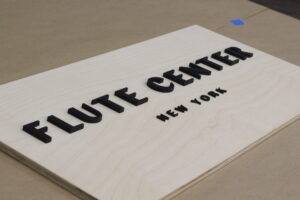 custom natural wood finish with 3D black laser-cut letters