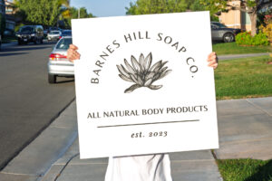 personalized white wood sign for a bespoke all natural body products company