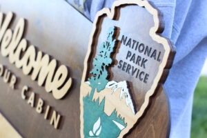 custom national park service sign with hand painted arrowhead emblem and exterior finish that gives it a glossy look.