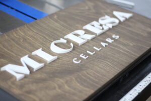 custom aged walnut business sign for winery and cellar company with white 3D letters