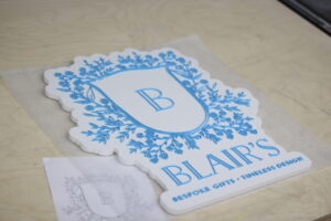 custom wooden sign for a bespoke gifts company