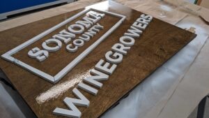 personalized logo winery winegrower, cellar sign with exterior finish being applied