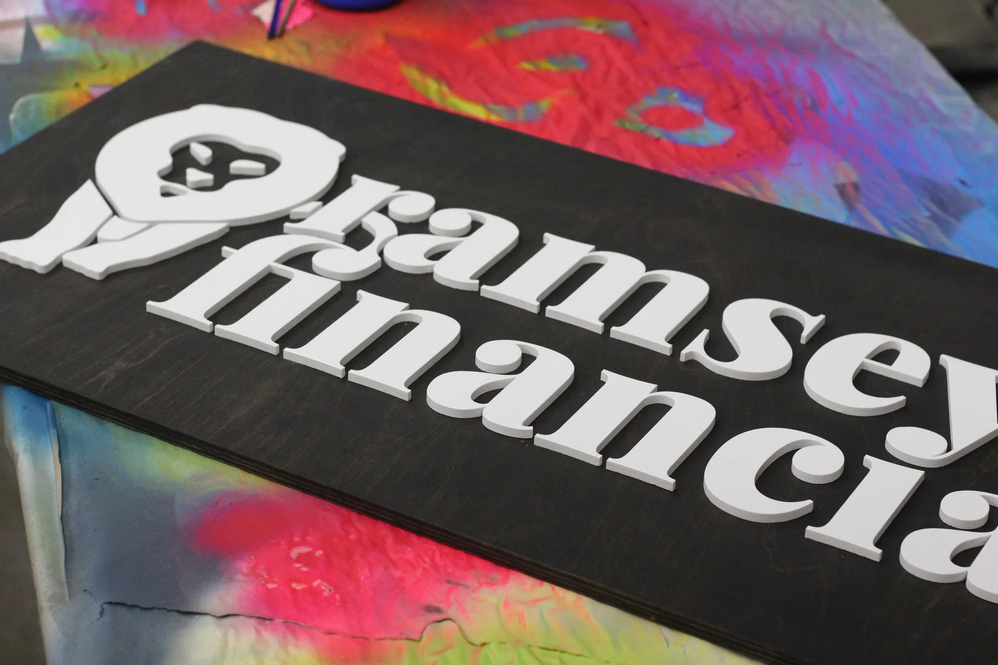 Detail of white lettering on ebony