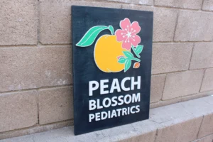 Custom wood sign by Lighthouse Laser Co. - Pediatric Office