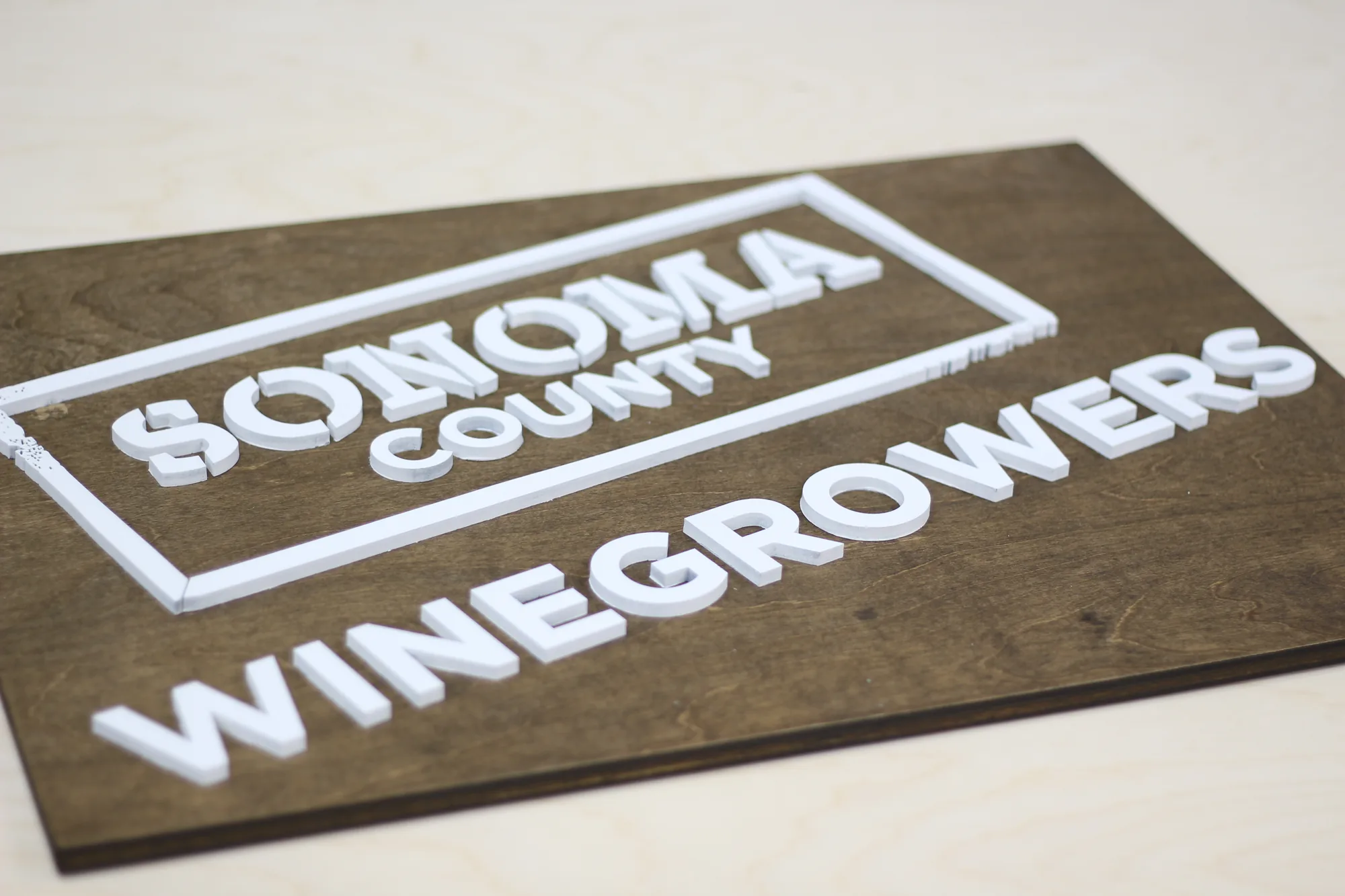 Winery sign shown mounted in the tasting room