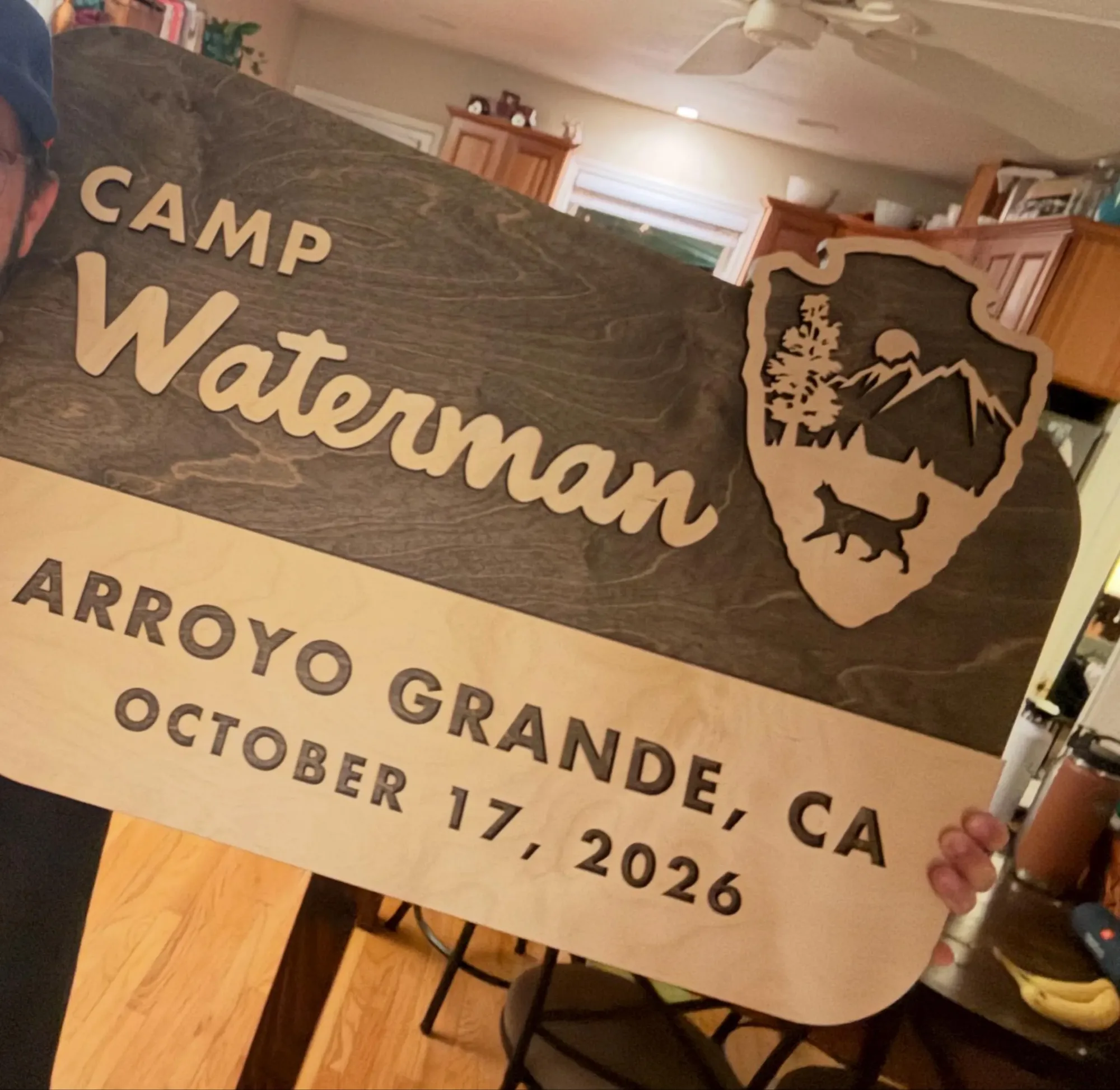 Camp name park style sign with a town and a date on the bottom line